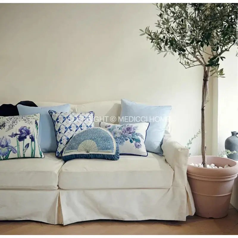 Cream-colored sofa with decorbites iris flowers butterfly purple cushion covers featuring watercolor floral patterns