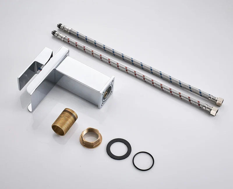 Modern chrome-finished waterfall bathroom faucet single hole with sleek rectangular design and matching braided metal hoses