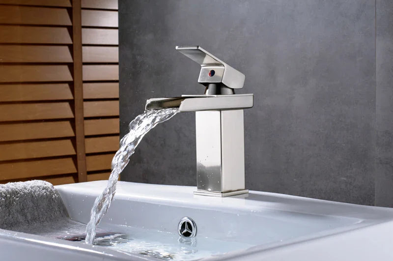 Modern chrome finished waterfall bathroom faucet single hole with sleek rectangular design and red accent button handle