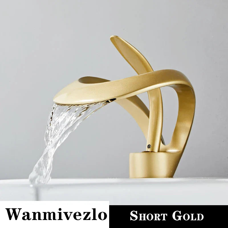Gold-colored deck mounted single hole waterfall bathroom basin faucet with brass body and modern twisted design for hot cold water