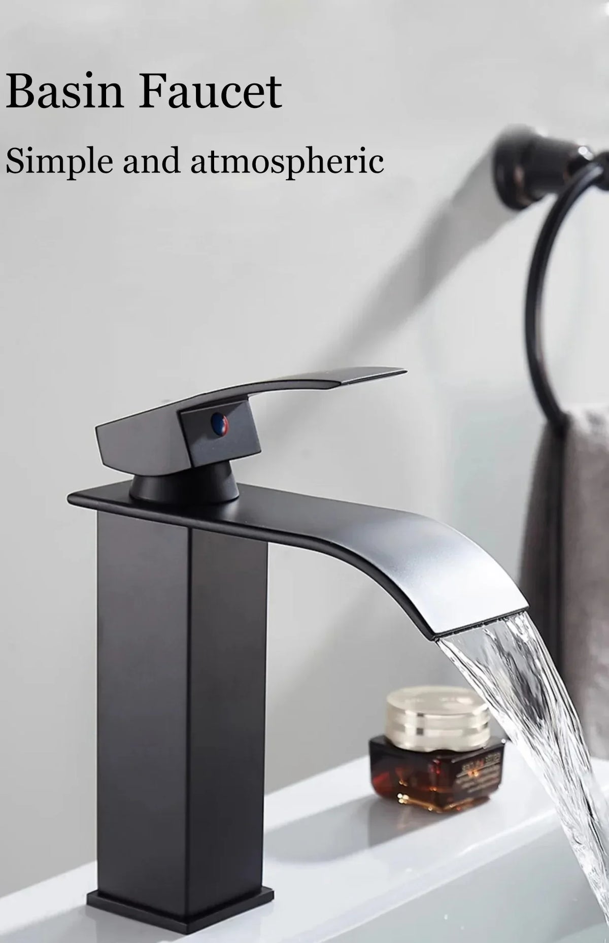 Black matte stainless steel wash basin faucet with sleek modern design and waterfall spout for bathroom use