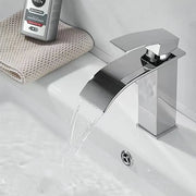 Modern chrome finished stainless steel waterfall faucet with sleek angular design for wash basin bathroom use