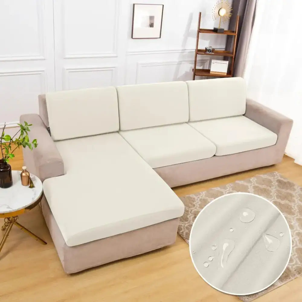 Cream-colored stretchy sofa cover with a smooth water-resistant surface for living room sofa protection