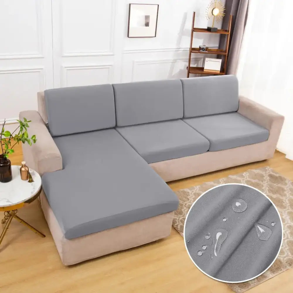 Waterproof gray elastic sofa cushion cover made of stretchy fabric with water-resistant properties for living room protection