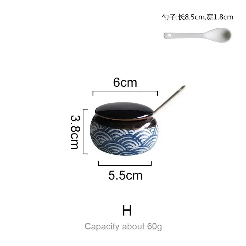A ceramic seasoning set with decorbites blue ceramics featuring a blue wave-patterned body and glossy black lid