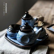 Blue and white ceramic seasoning set with wave patterns including teapot small jars and tray for blue ceramics kitchen decorbites