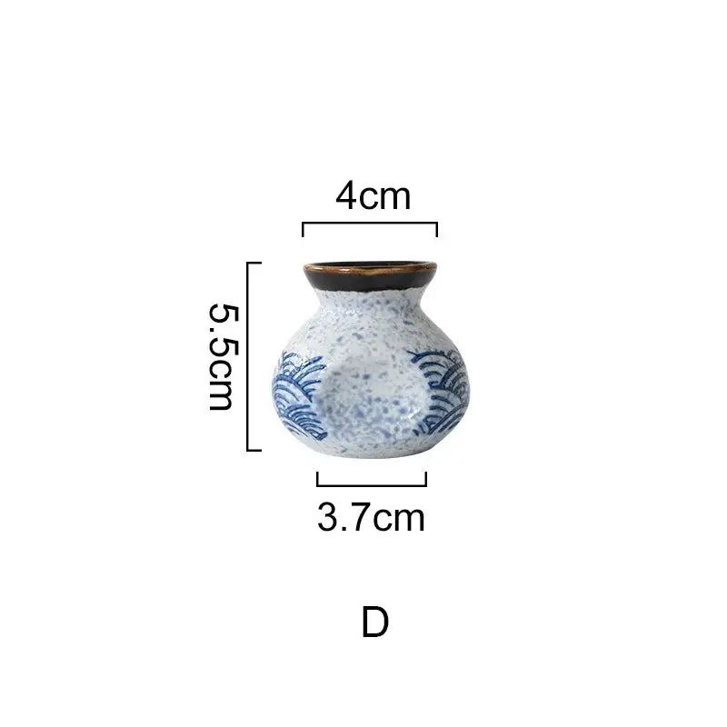 A small ceramic vase with a speckled white and blue wave pattern and dark brown rim for blue ceramics kitchen seasoning set decorbites