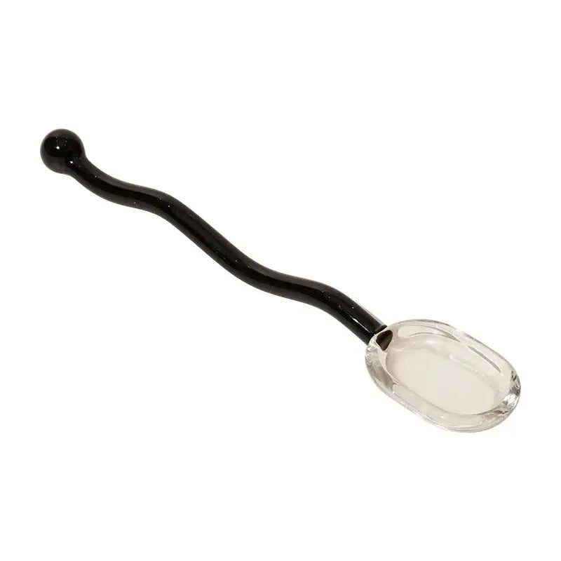 A sleek black glass spoon coffee stirring rod with a clear faceted bowl and curved handle for spoon coffee stirring