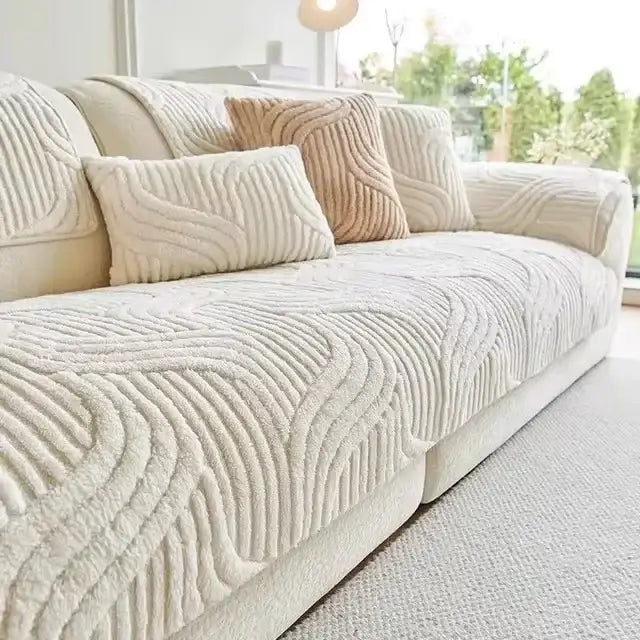 Cream-colored plush sofa cover with wavy ribbed textured pattern for living room use