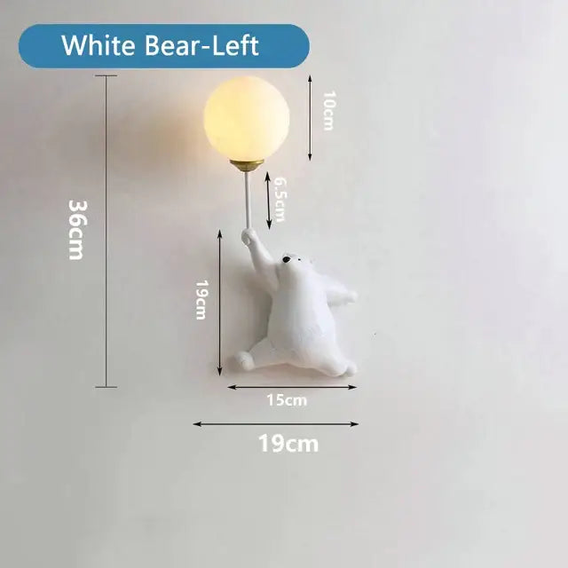 Whimsical blue pink and white bear wall lamp featuring a white bear holding a warm-toned spherical bulb for kids bedroom