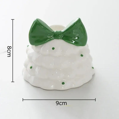 White ceramic tiered cake candle holder with green polka dots and glossy bow decorbites bowknot tree design