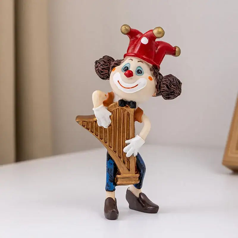 A cheerful red clown resin art statue holding a golden harp crafted from painted plastic for decorbites clown resin collection
