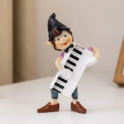 Whimsical clown resin art statue of a smiling elf in a black hat with a white accordion for decorbites clown resin collection