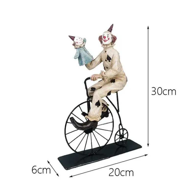 Whimsical cream circus clown joker figurine painted with black spades rides a vintage dark metal bicycle for living room decor