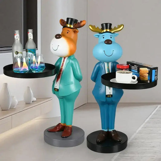 Two whimsical deer landing tray ornaments dressed in formal suits holding trays with drinks for living room decor