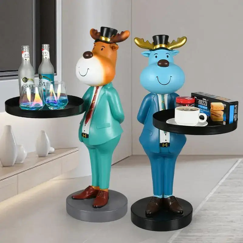 Two whimsical deer landing tray ornaments dressed in formal suits holding trays with drinks for living room decor