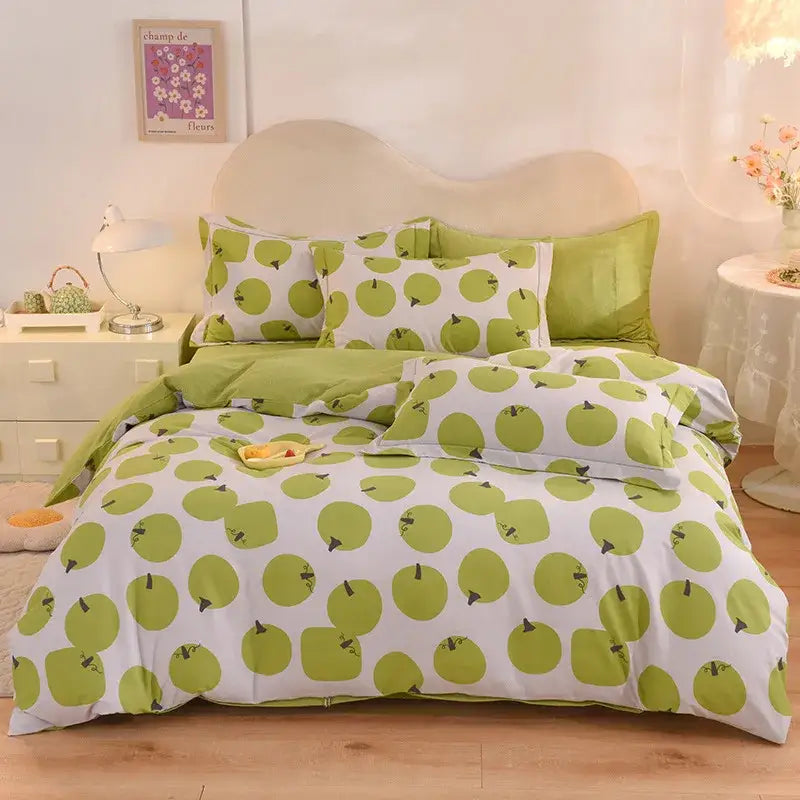 Whimsical pastel mint cotton thickened bedding set with lime green apple pattern and black stem decor on white background