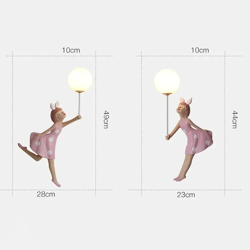 Whimsical pink polka dot fairy girl wall lamp holding a spherical lamp ideal as a girl wall lamp for bedroom decor