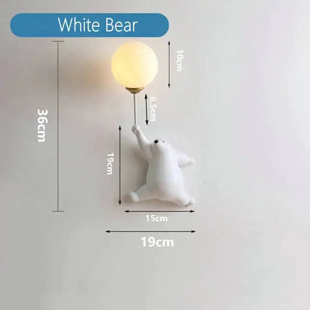 White bear wall lamp with warm spherical bulb held by the polar bear’s paw in whimsical pink polka dot girl wall lamp design
