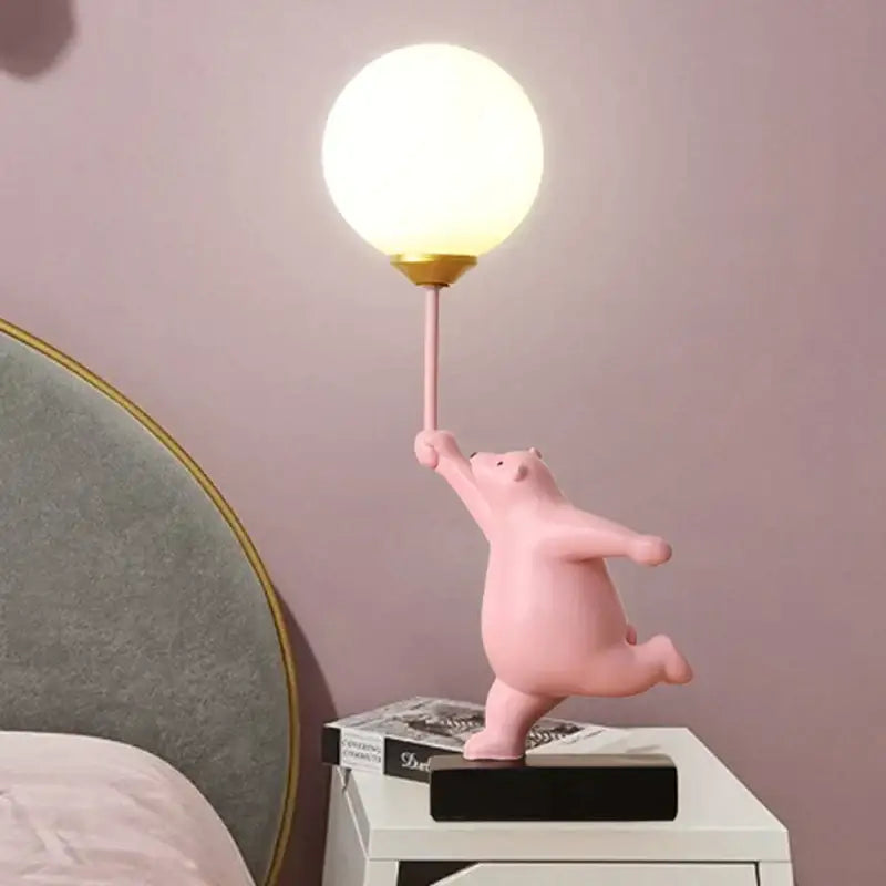 Pink resin bear moon lamp figurine holding a glowing spherical lamp with gold accents for bedroom table lamp