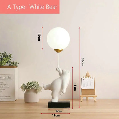 White ceramic bear moon lamp with gold stem and spherical lampshade on black base for bedroom table lamp