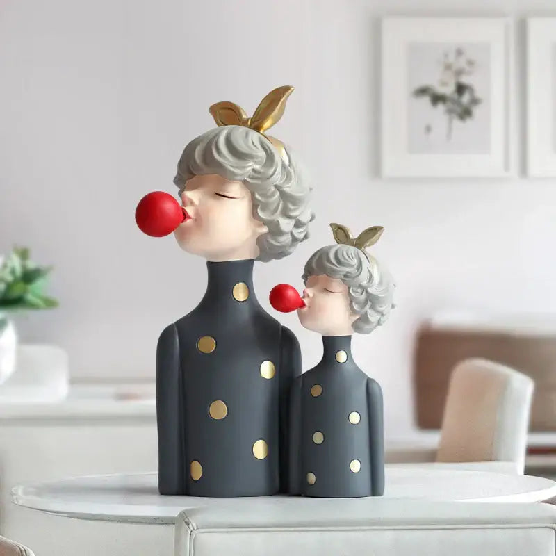 Gray resin bubble girl figurines with curly hair gold polka dots and bunny ears blowing red bubbles for decor