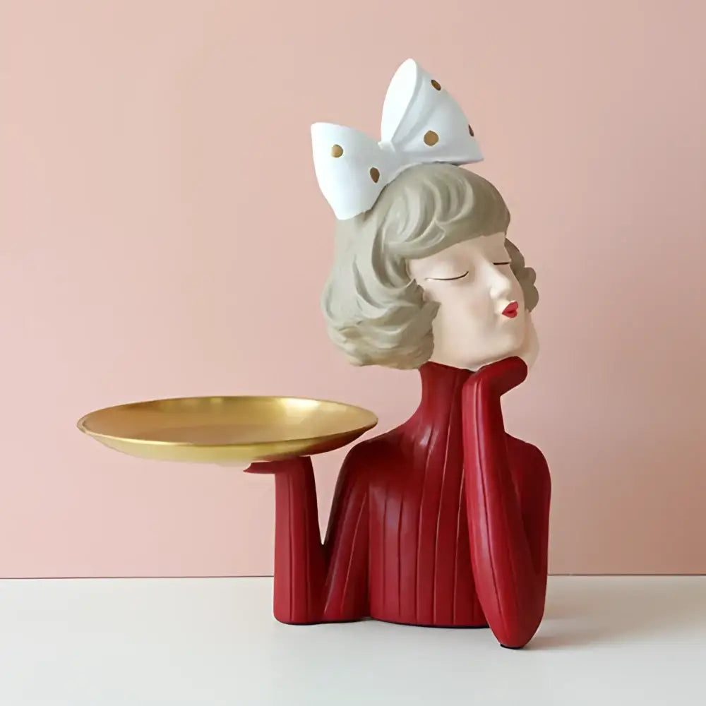 Whimsical red bubble girl resin figurine with short gray hair white polka dot bow holding gold tray living room decor