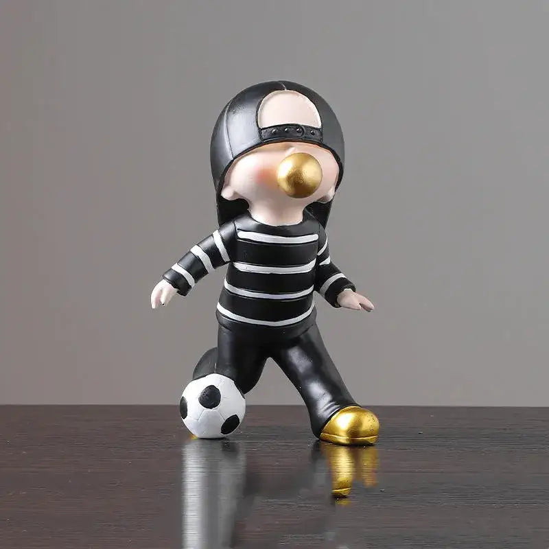 Whimsical black and white striped resin boys sports statue with gold accents for decorbites boys sports bedroom decor