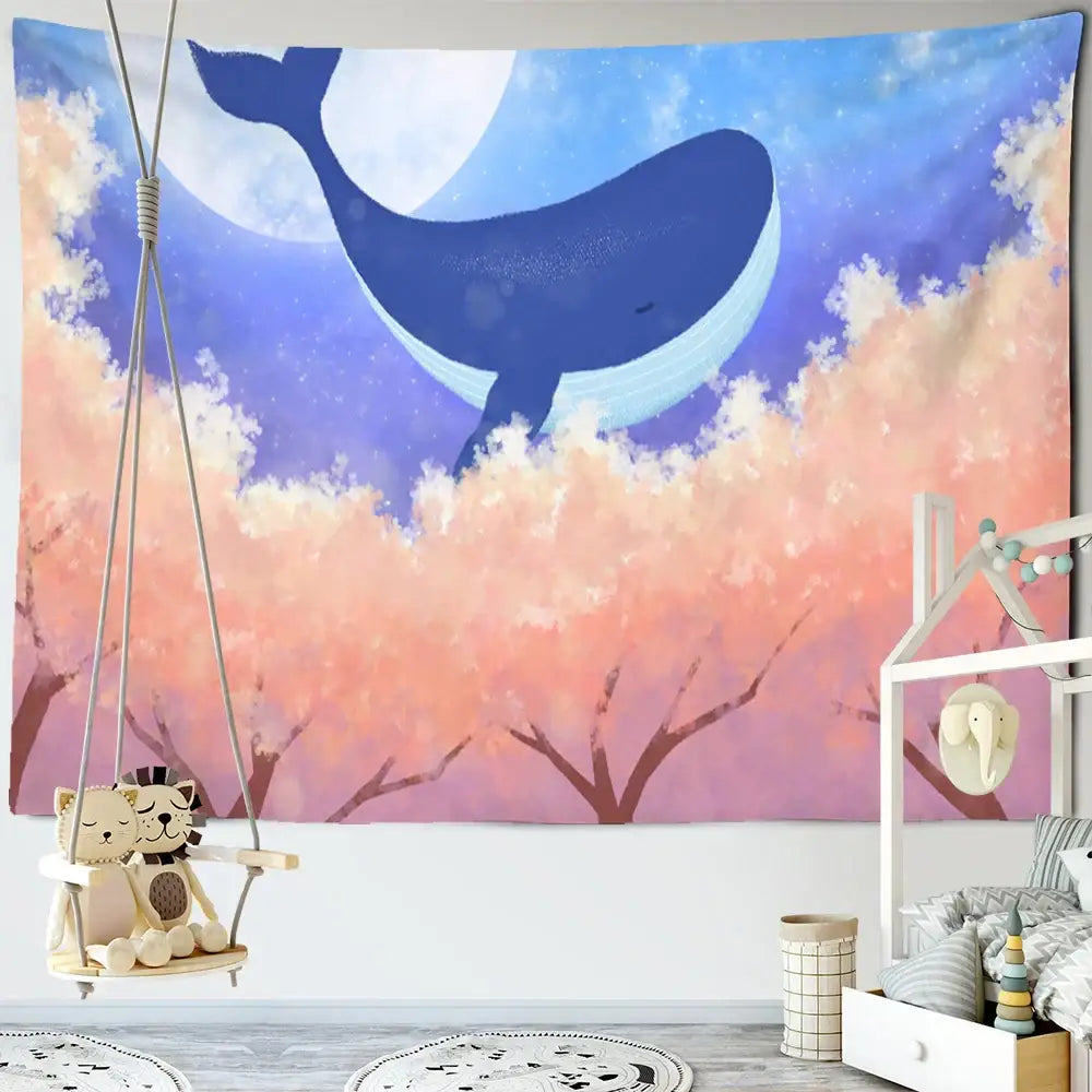 A soft blue whale decorbites dream whale tapestry wall hanging with a whimsical gradient sky for kids room decor