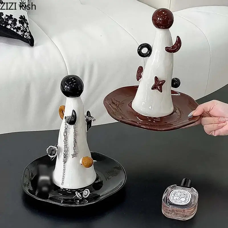Whimsical white and brown ceramic jewelry display stand with glossy black and maroon accents and star-shaped ornamentation