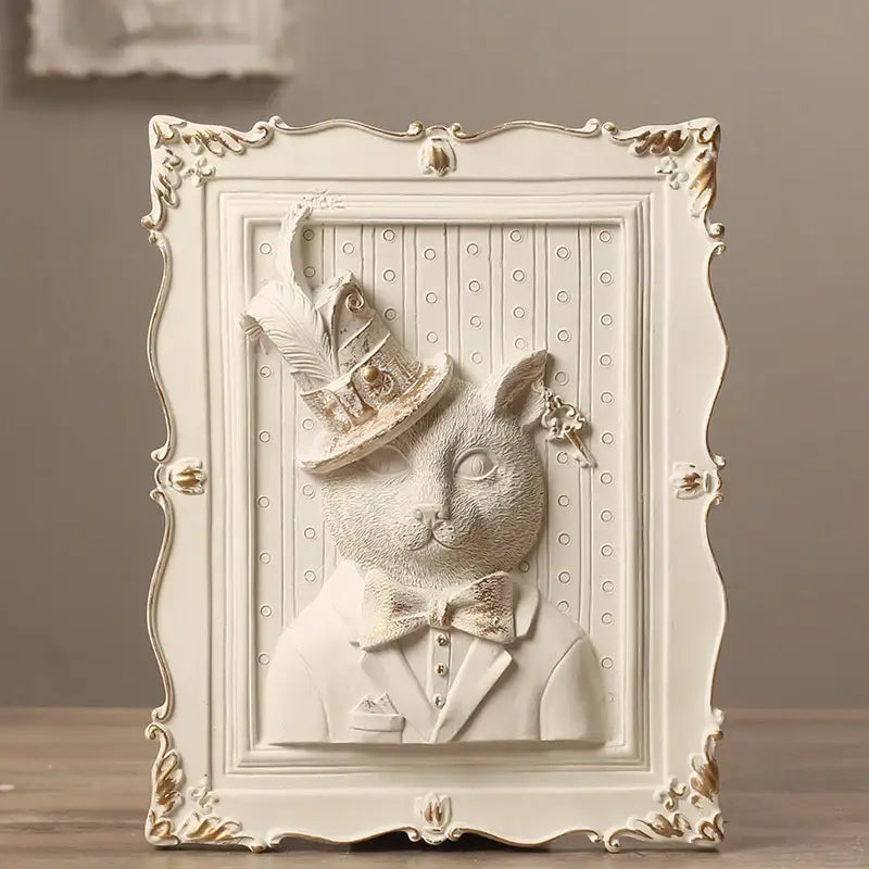 White and gold ornate wall decoration frame featuring a sculpted cat in formal attire for bedroom decor