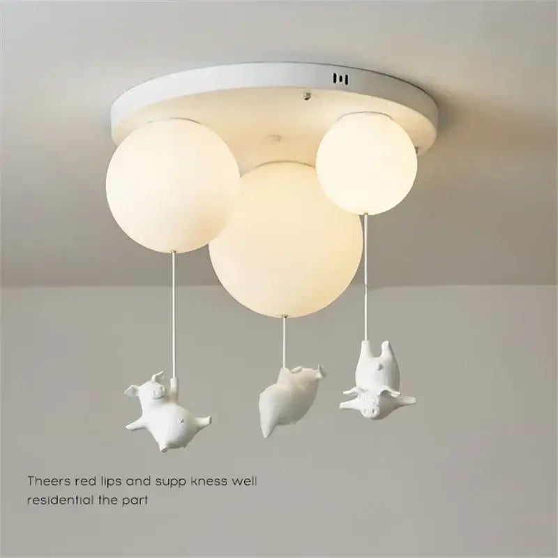 White ceramic pig resin led ceiling light with spherical frosted glass shades for whimsical bedroom decor