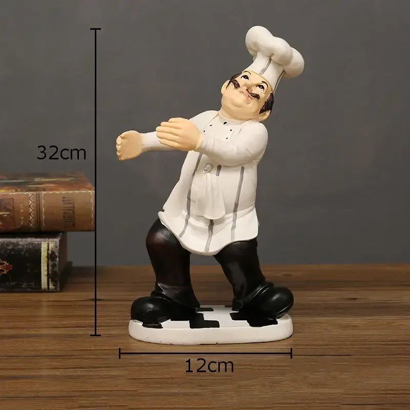 Whimsical white and black bearded chef resin figure with tall toque and detailed uniform for kitchen decor