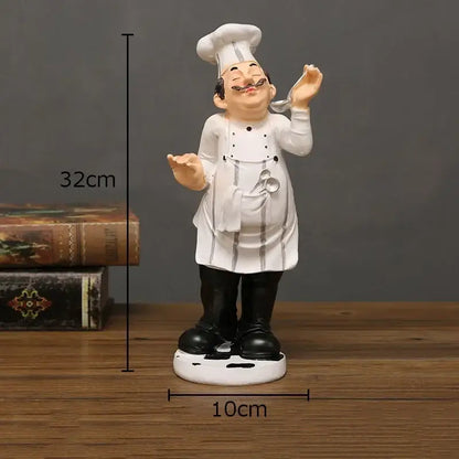 Whimsical white and black bearded chef resin figure with tall hat apron mustache and spoon kitchen decor