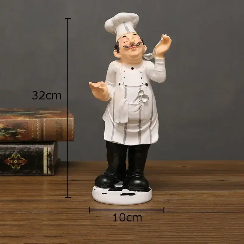 Whimsical white and black bearded chef resin figure with tall hat apron mustache and spoon kitchen decor