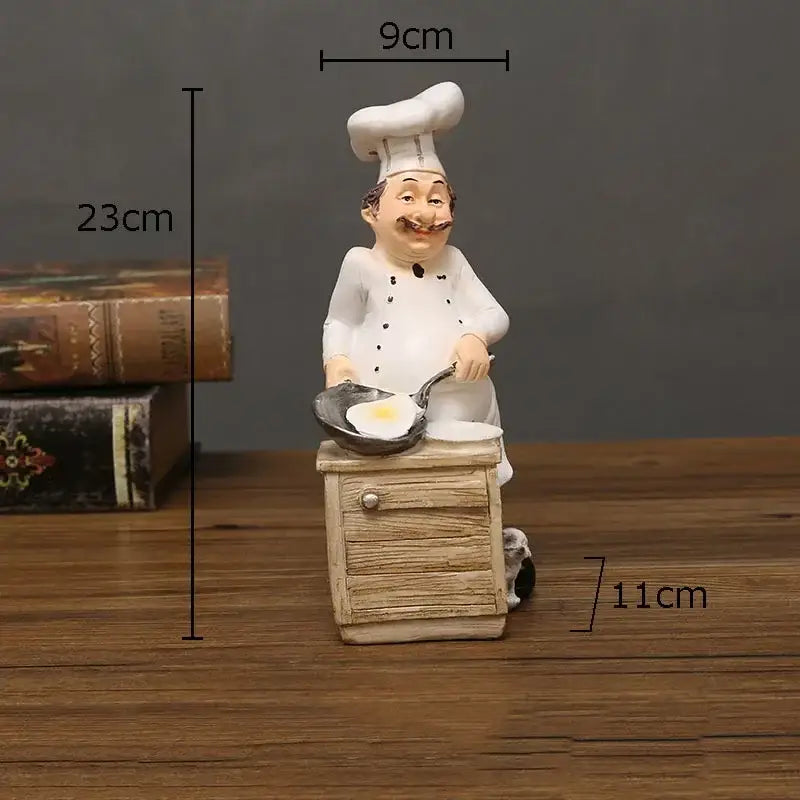 Whimsical white bearded chef resin figure cooking an egg on a pan standing on a miniature wooden cabinet kitchen decor