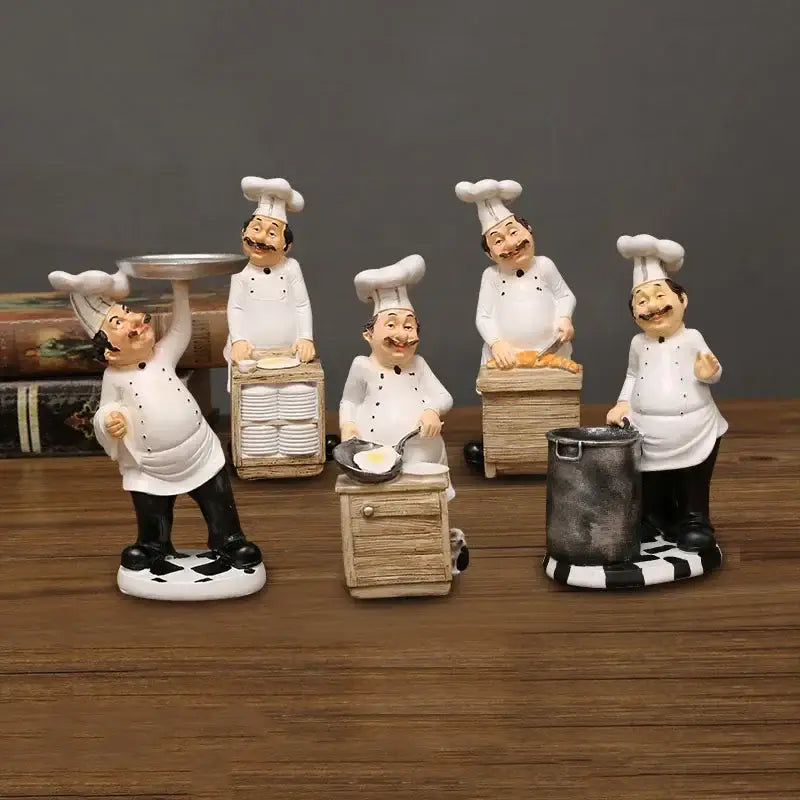 Set of five whimsical white bearded chef resin figures in white uniforms with black accents for kitchen decor