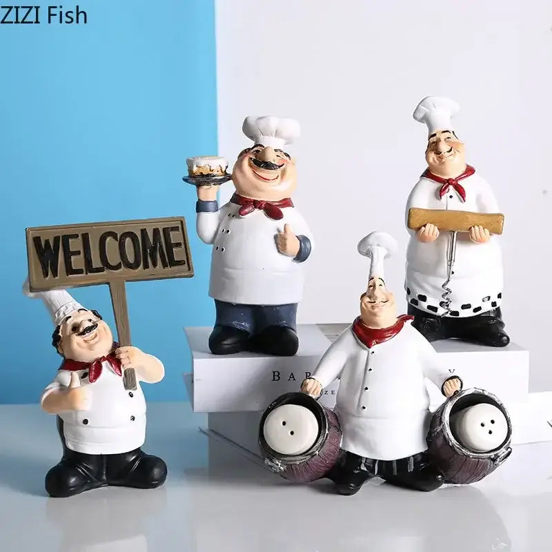 Set of four whimsical white bearded chef resin figures with red scarves and black boots holding kitchen props