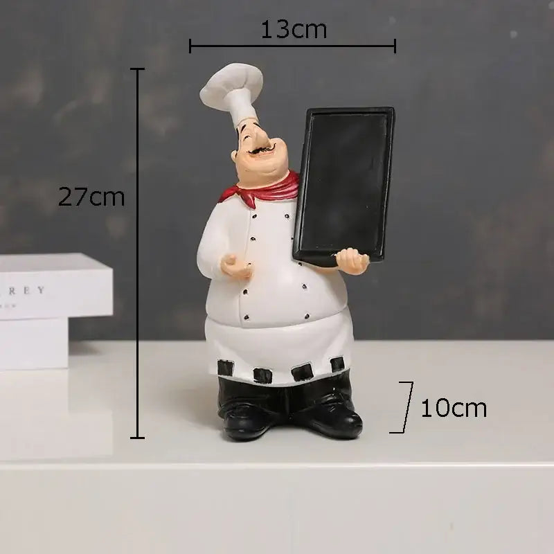 Whimsical white bearded chef resin figure with red scarf holding black chalkboard kitchen decor accessory