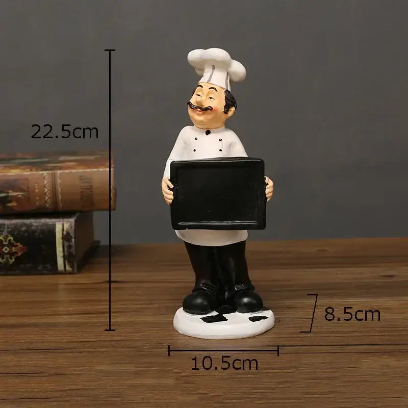 Whimsical white bearded chef resin figure in double-breasted coat holding blank tray for kitchen decor