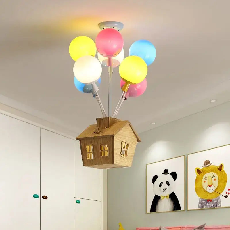 Whimsical wooden house balloon ceiling chandelier with colorful yellow pink and blue balloon bulbs for nursery lighting