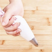 White disposable pastry bag with stainless steel tip made of silicone for kitchen baking and decoration use