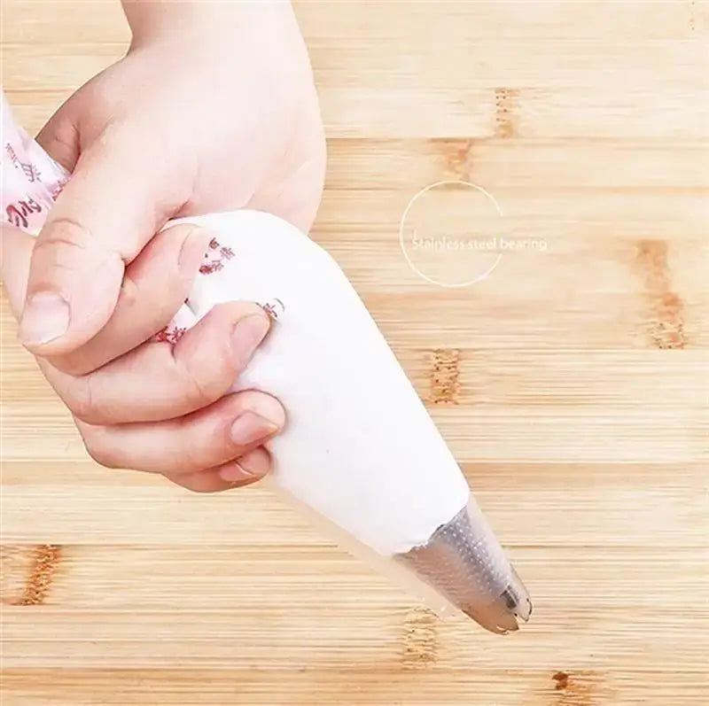 White disposable pastry bag with stainless steel tip made of silicone for kitchen baking and decoration use