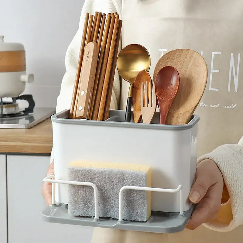 White and gray plastic kitchen utensil holder with wire rack and two sponges in double grid cutlery organizer design