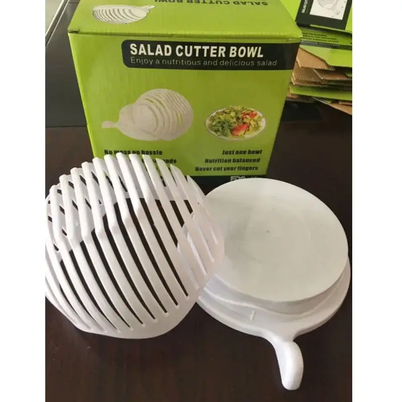 White plastic easy salad cutter bowl with ribbed slotted design and handle for kitchen vegetable slicing
