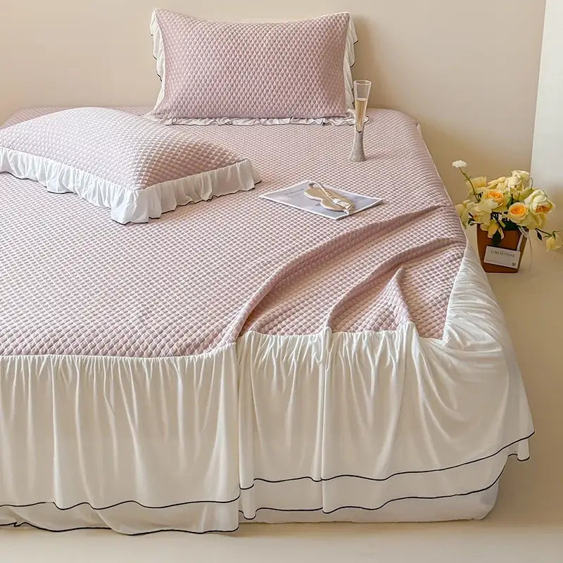 Pink quilted bedding set with white ruffled trim and black piping for decorbites cool feeling bedroom decor