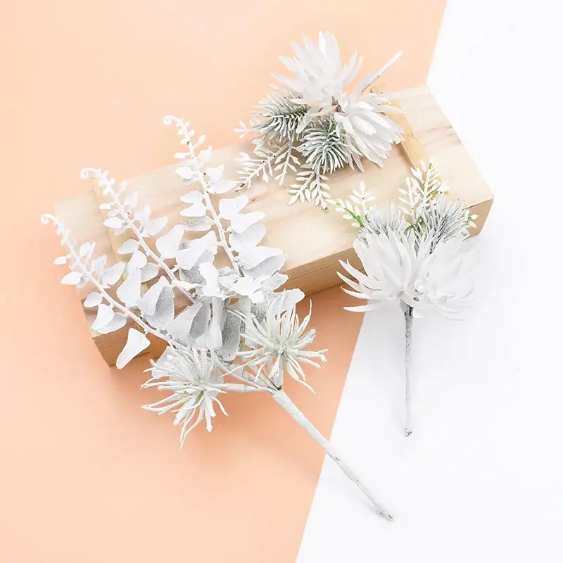 White and frosted green decorbites decorative flowers wedding bouquet with artificial winter foliage and spiky blooms