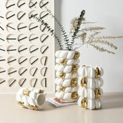 White and gold carambola ceramic vase with textured segmented design and gold leaf accents for living room decorbites lemon carambola
