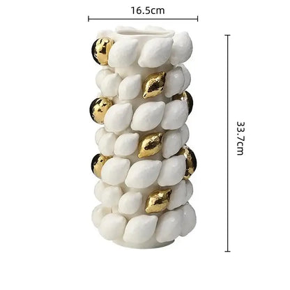 A tall white and gold carambola ceramic vase with textured shell shapes and gold beads for living room decorbites lemon carambola