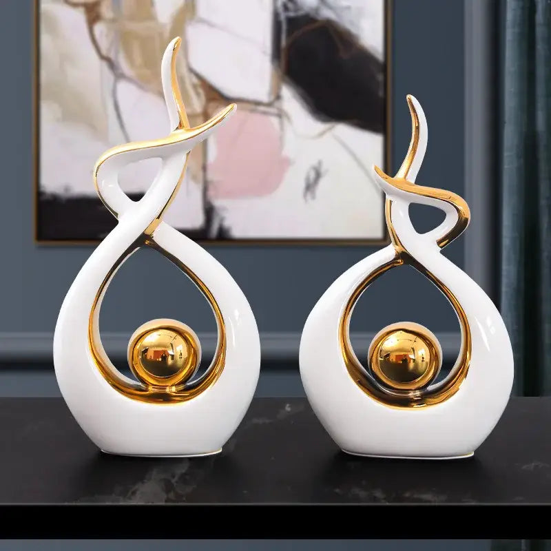 White and gold ceramic abstract figurine set with a central golden sphere for living room decorbites ceramic abstract decor